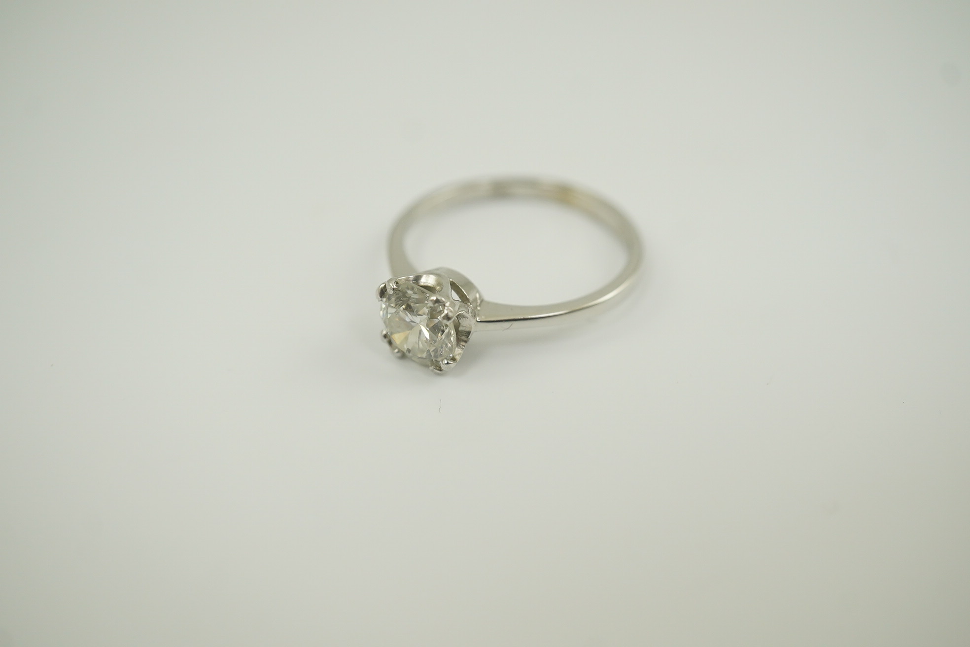 An 18ct white gold and solitaire diamond set ring